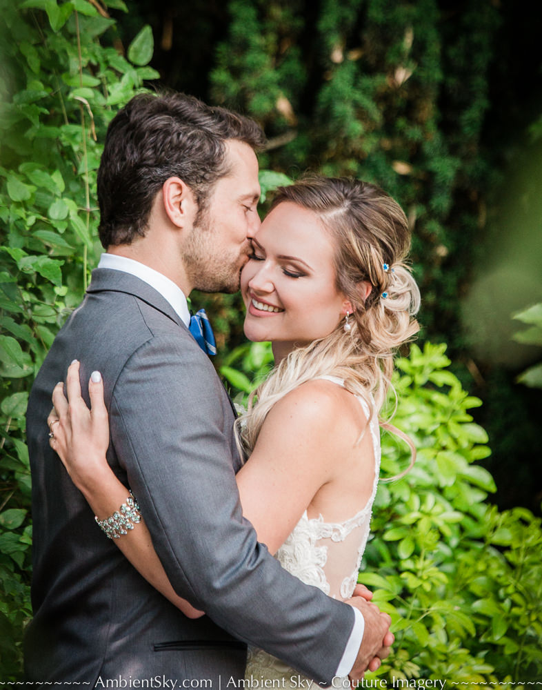Bride and groom embracing in the garden at their portland wedding
