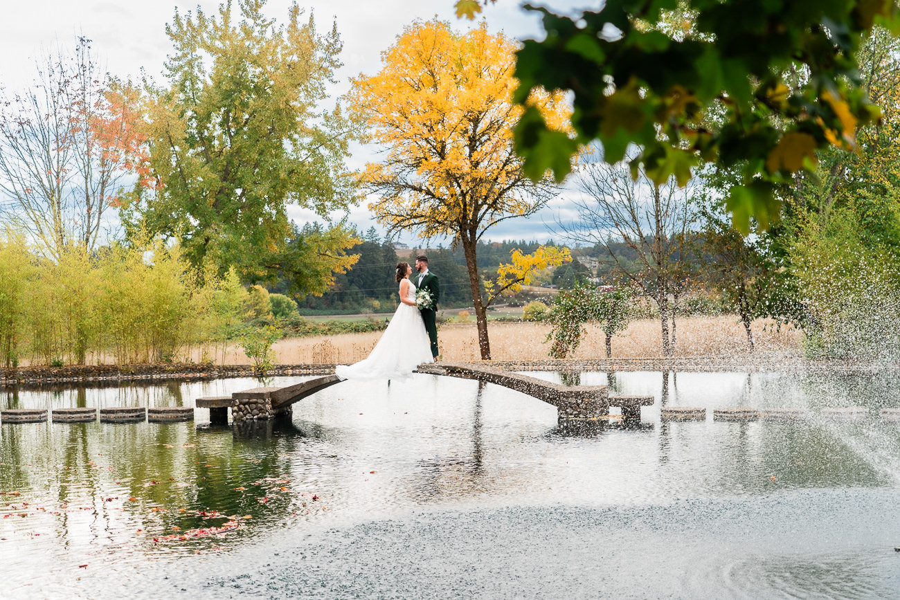 Oregon Wedding Photography at the Water Oasis bride and groom on bridge over water